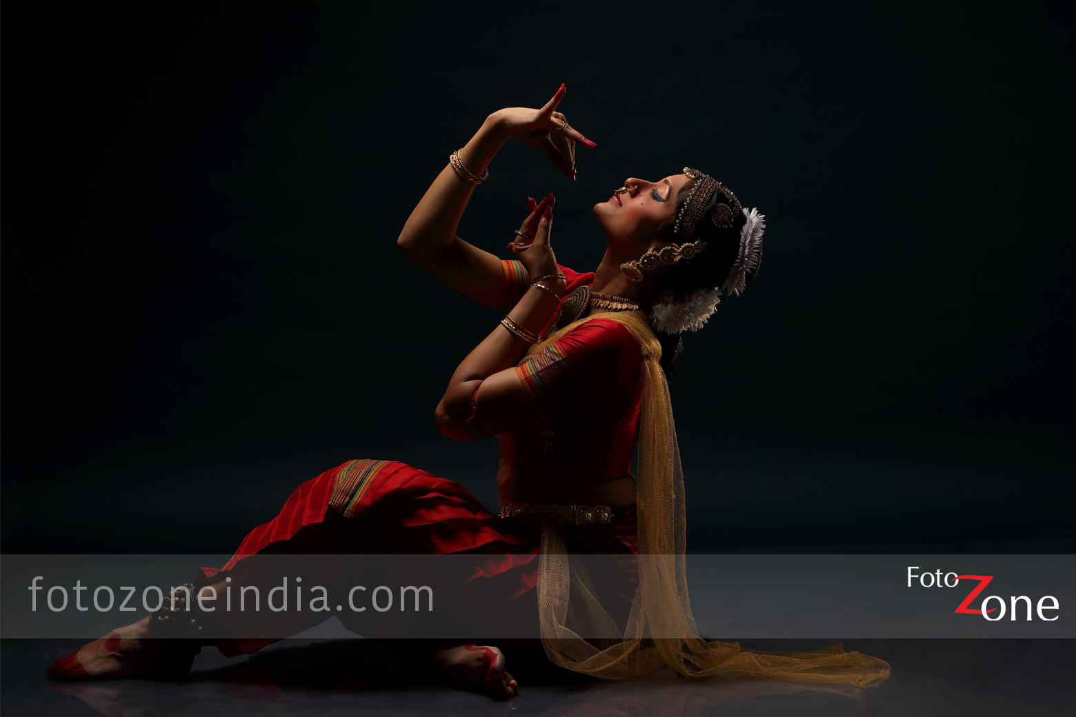 Bharatanatyam dancer putting on her khungru Stock Photo | Adobe Stock